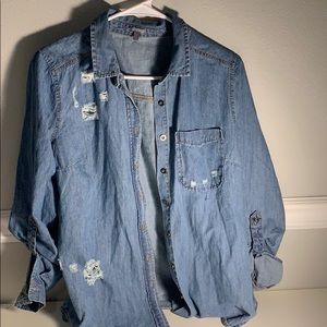 A ripped Jean jacket looking flannel